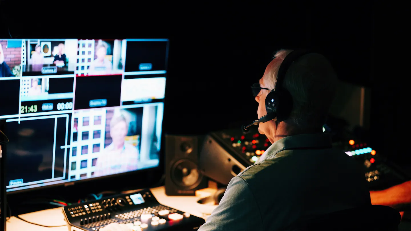 Man at tv control monitor