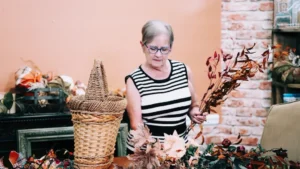 Susan arranging fall florals