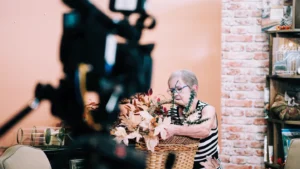women decorating with camera blurred in foreground