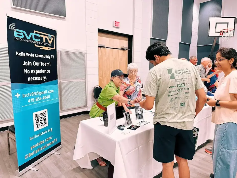 Volunteers working at a booth.